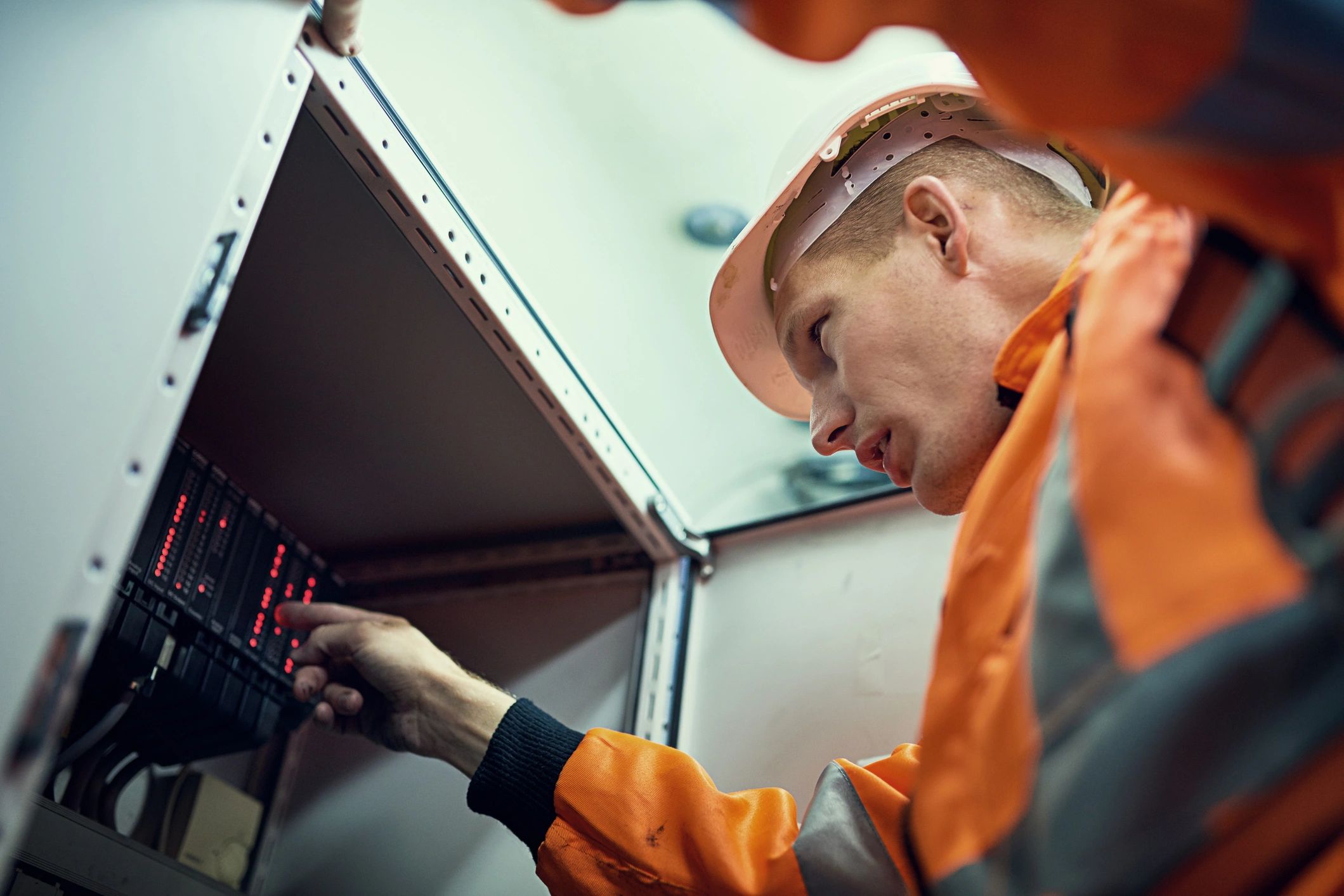 Technician using professional equipment during HVAC maintenance